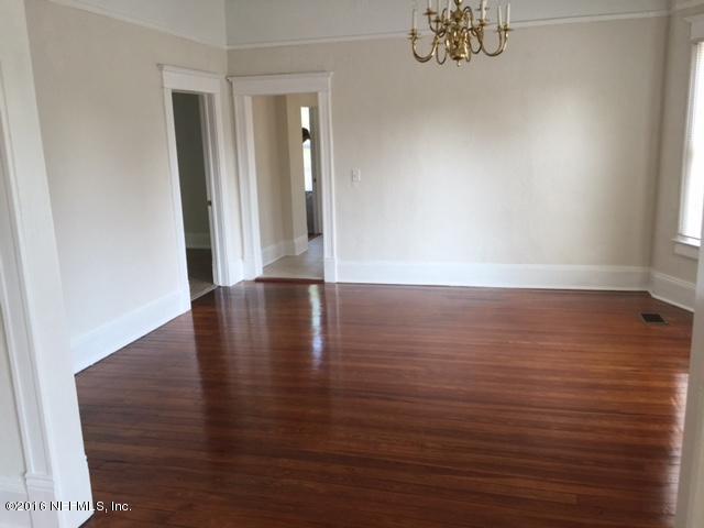 3308 St Augustine Road Jacksonville, FL 32207 - Photo 10 of 21 an empty room with wooden floor and windows