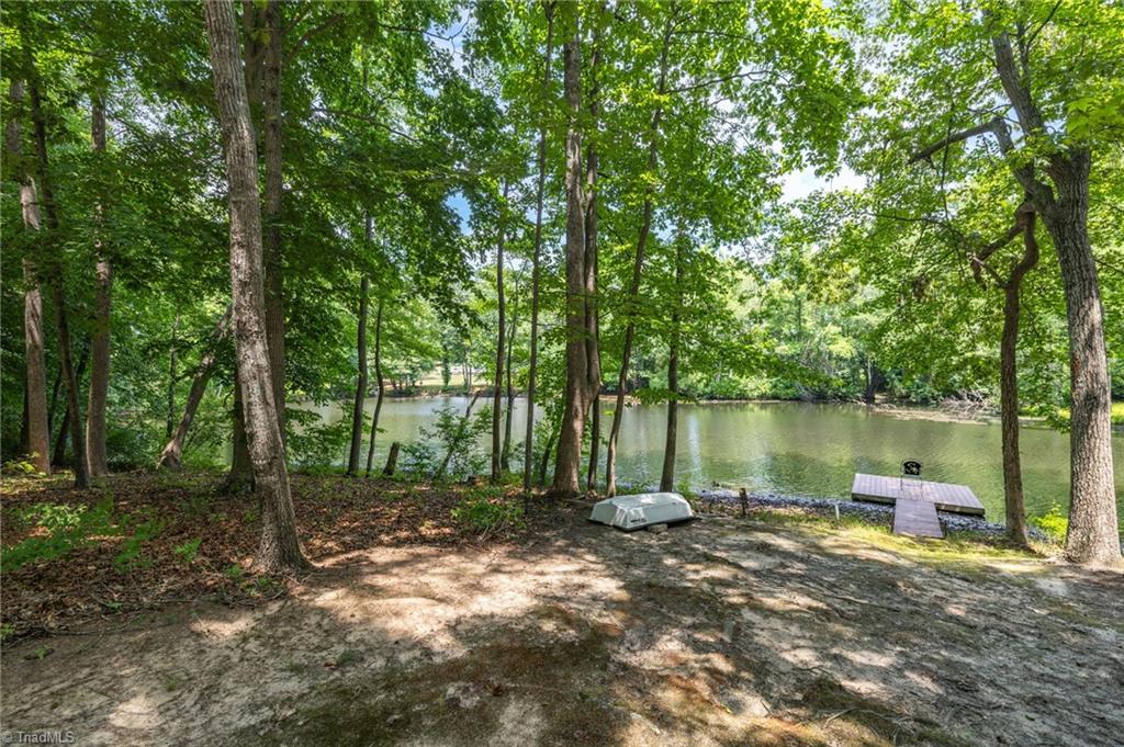 2800 Spencers Grove Road Browns Summit, NC 27214 - Photo 42 of 49 Pond view with John boat that stays.