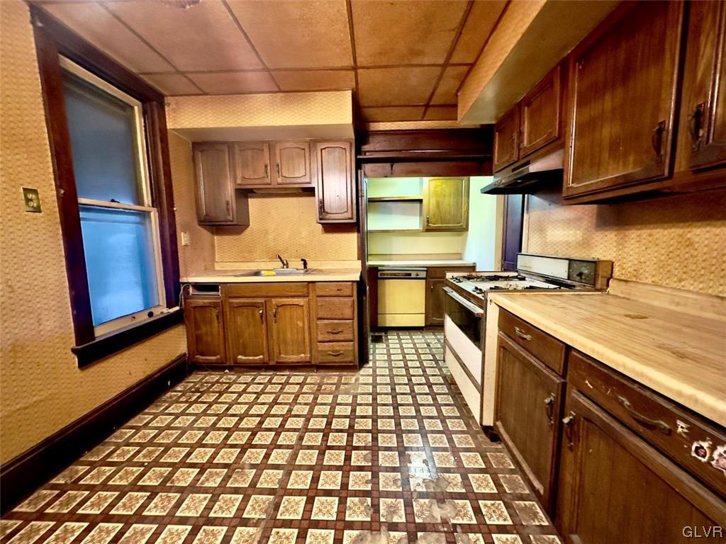 2052 West Broad Street Bethlehem, PA 18018 - Photo 8 of 23 a kitchen with a sink appliances cabinets and a counter top space
