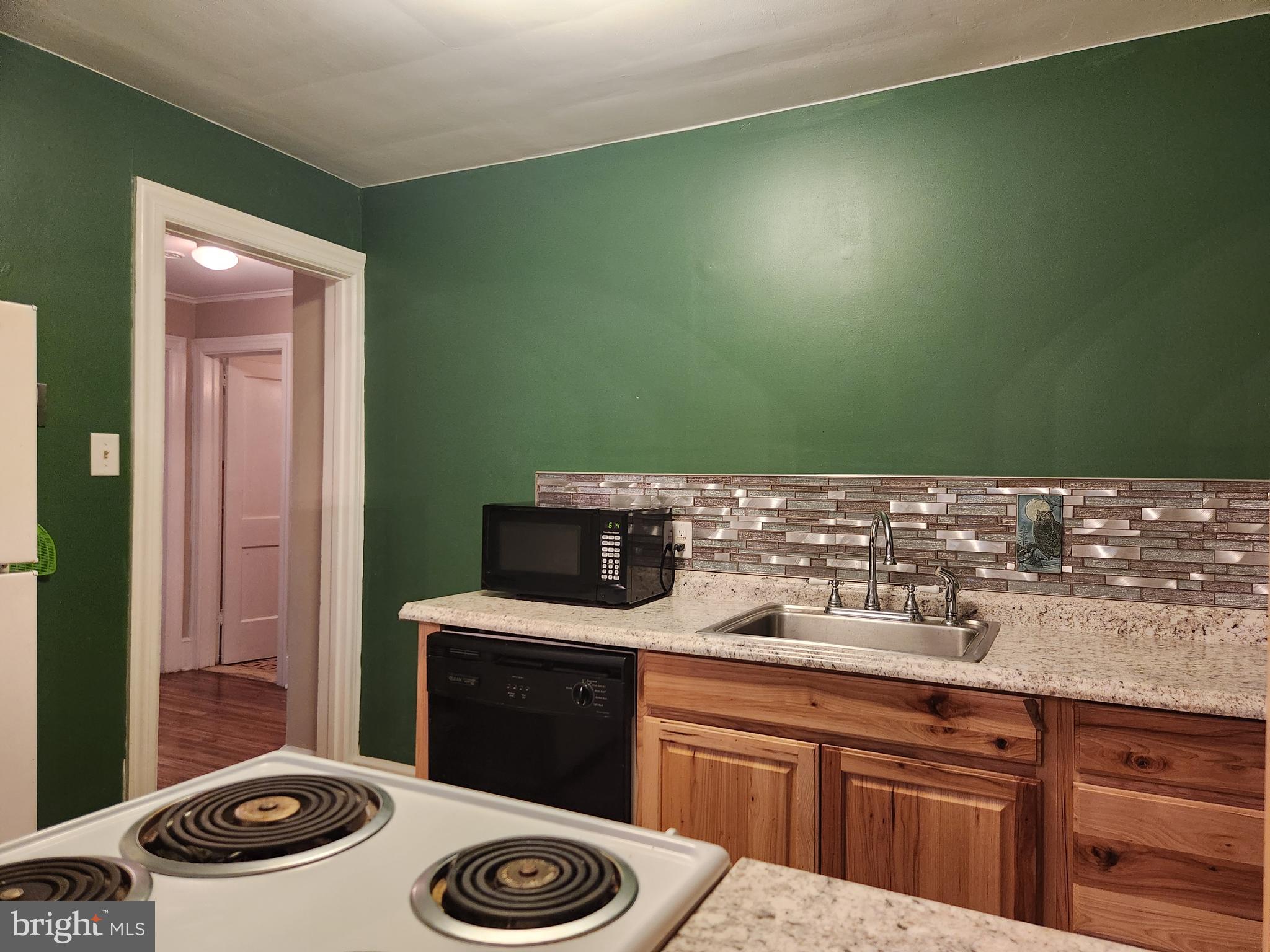 512 State Street Seaford, DE 19973 - Photo 11 of 32 a bathroom with a sink and a toilet