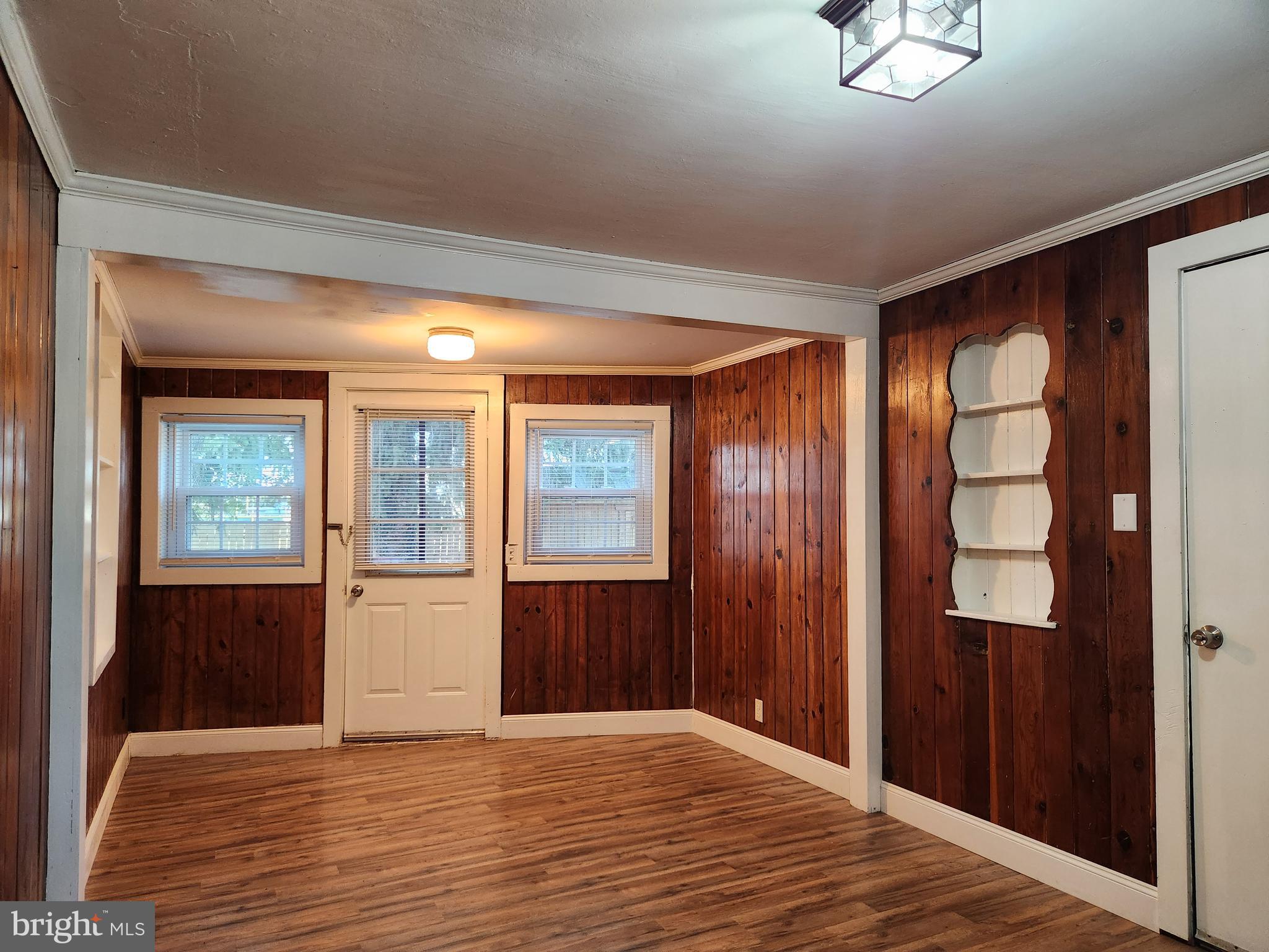 512 State Street Seaford, DE 19973 - Photo 15 of 32 wooden floor in an empty room with a window