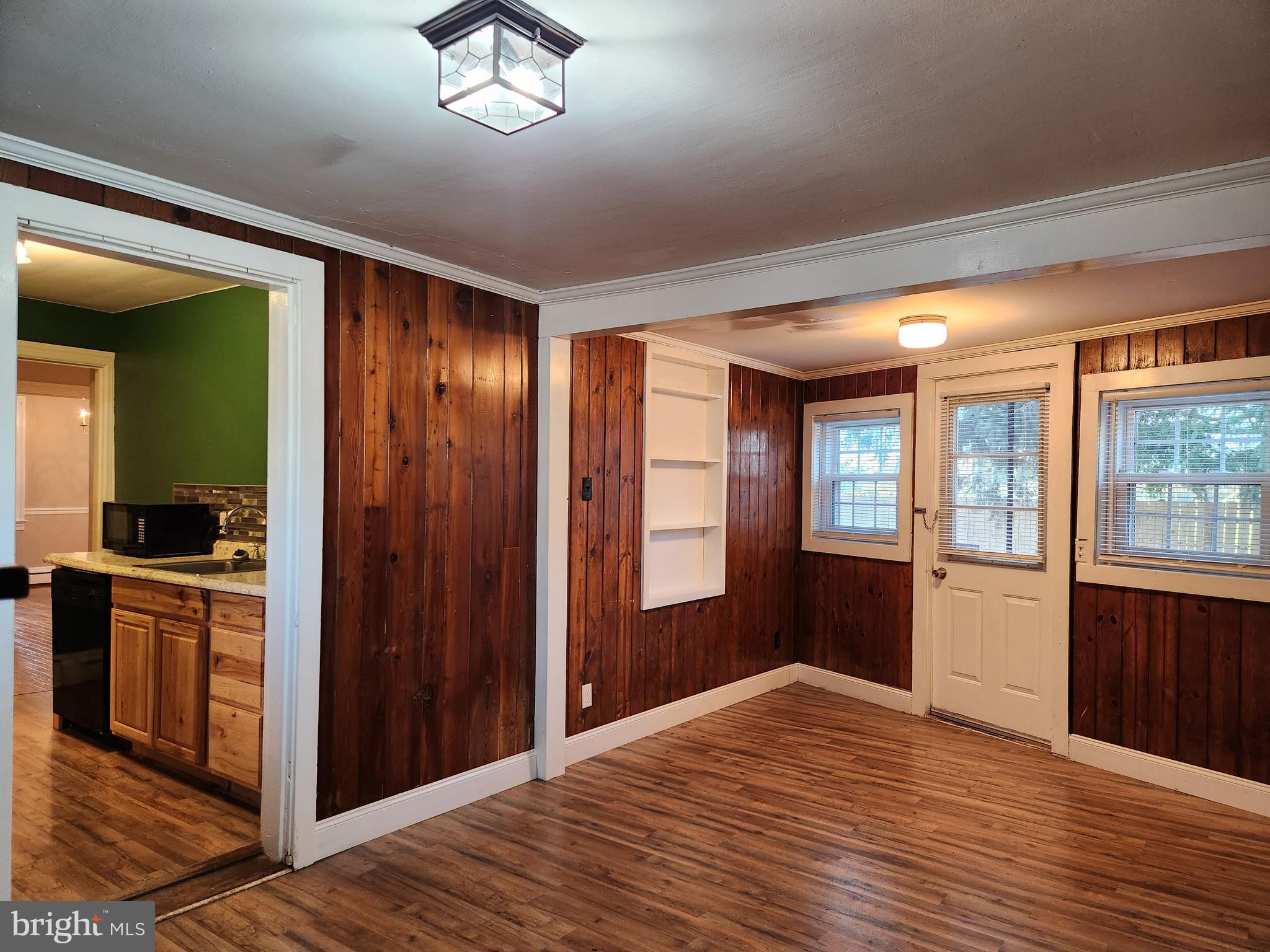 512 State Street Seaford, DE 19973 - Photo 16 of 32 a view of empty room with wooden floor and fan