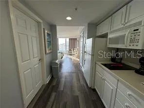 a kitchen with sink cabinets and stainless steel appliances