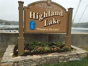 a sign broad in front of the house