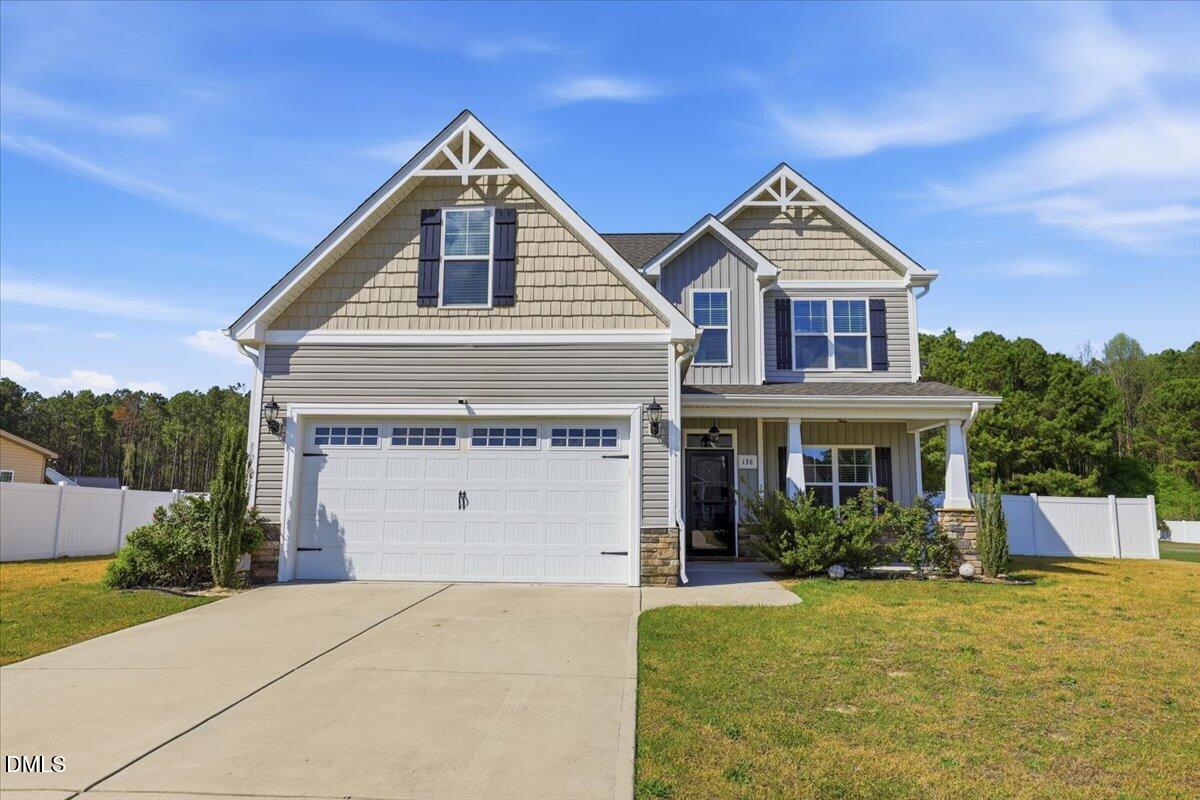 136 Fallingbrook Drive Kenly, NC 27542 - Photo 1 of 7 a front view of a house with a yard