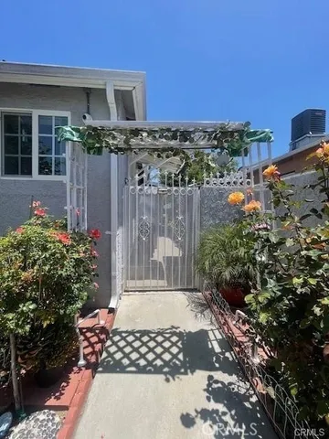 a view of a house with a flower garden
