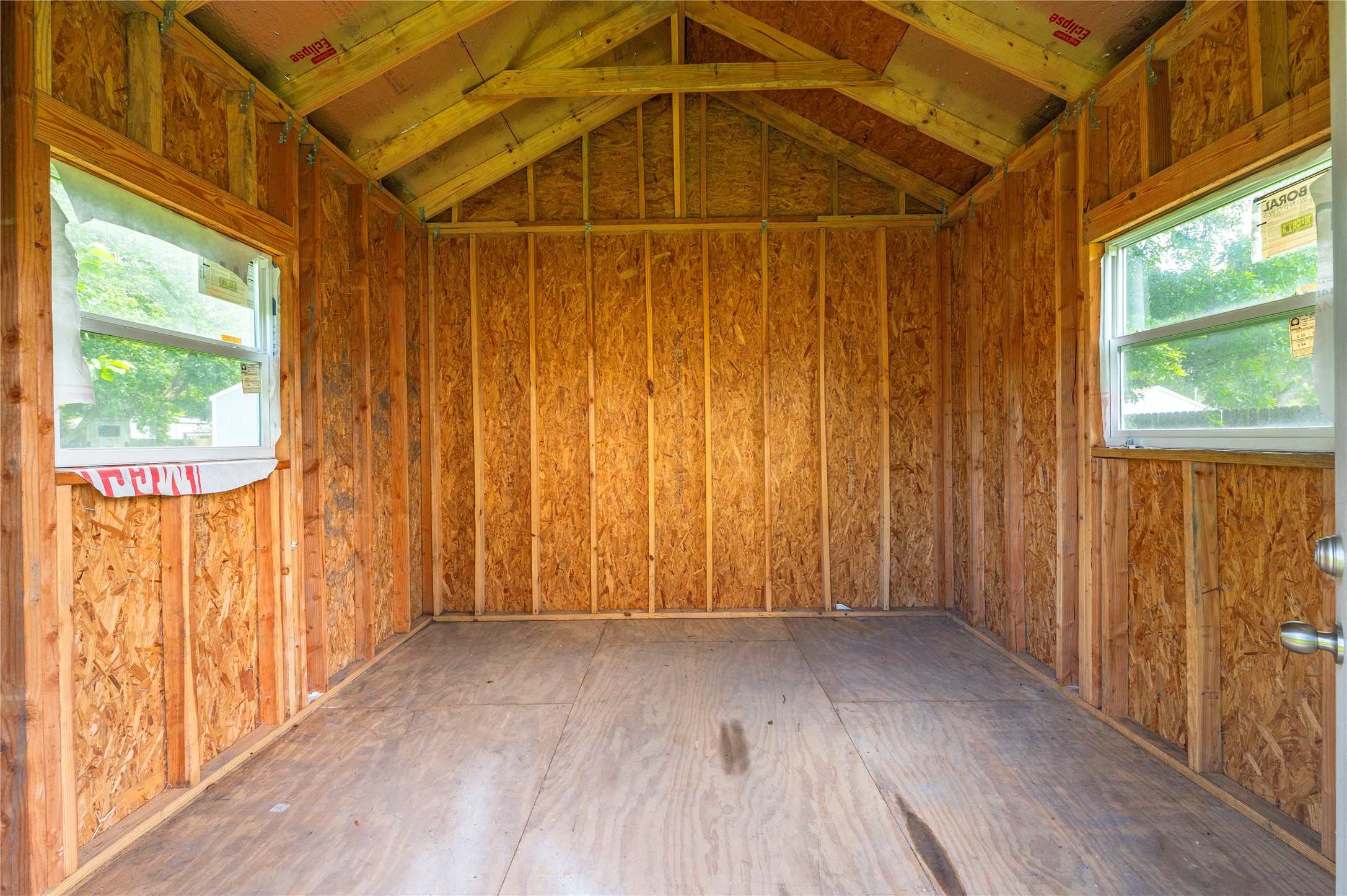 1125 Lake Road La Marque, TX 77568 - Photo 22 of 33 a view of a door in an empty room with wooden floor and walls