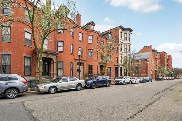 a view of a cars parked in front of a building