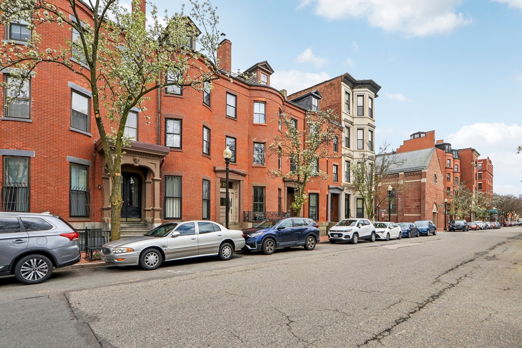 a view of a cars parked in front of a building