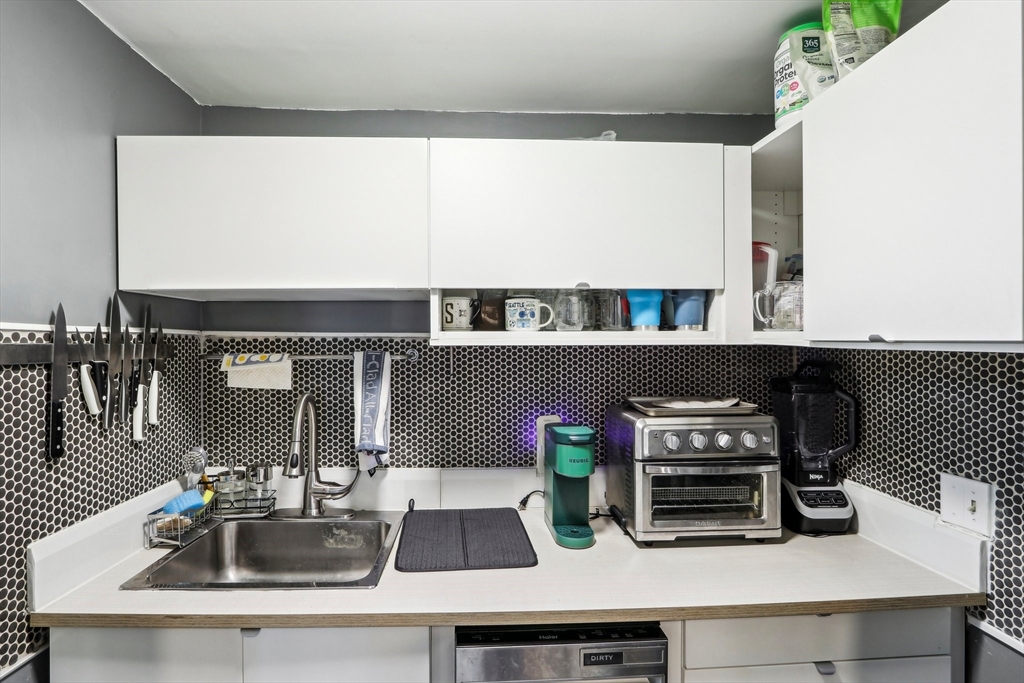 431 Shawmut Avenue, Unit 2 Boston, MA 02118 - Photo 11 of 25 a kitchen with a sink a counter and cabinets