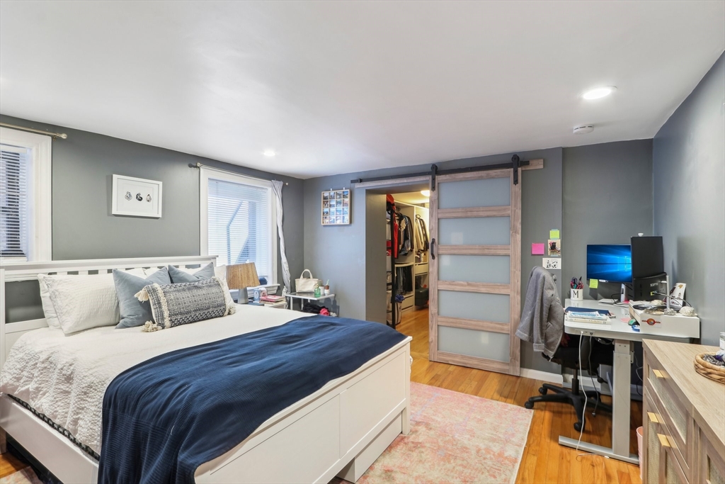 431 Shawmut Avenue, Unit 2 Boston, MA 02118 - Photo 13 of 25 a bedroom with a bed and a desk in it