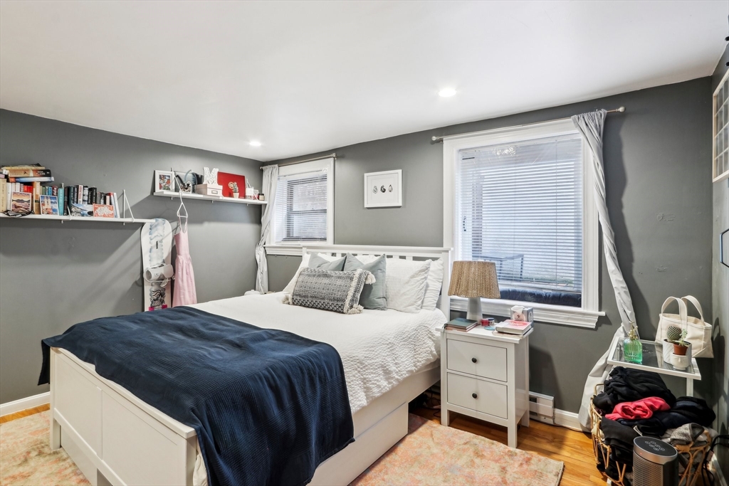 431 Shawmut Avenue, Unit 2 Boston, MA 02118 - Photo 16 of 25 a bed room with a bed and a window