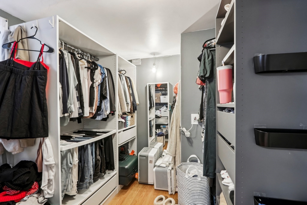 431 Shawmut Avenue, Unit 2 Boston, MA 02118 - Photo 17 of 25 a view of walk in closet with clothes and shoes