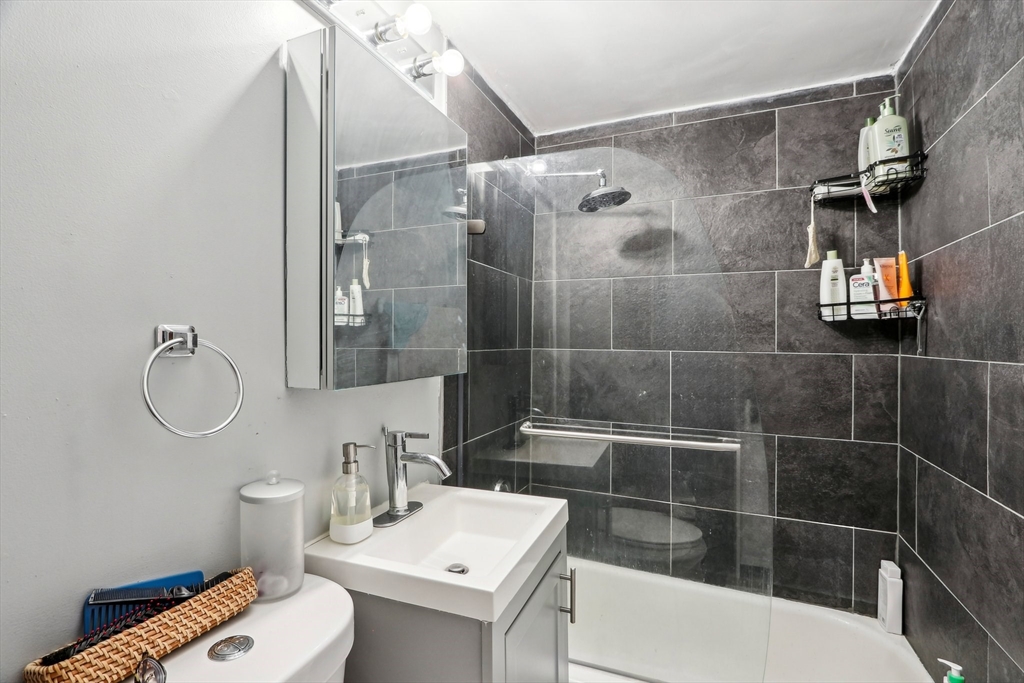 431 Shawmut Avenue, Unit 2 Boston, MA 02118 - Photo 19 of 25 a bathroom with a sink toilet and shower