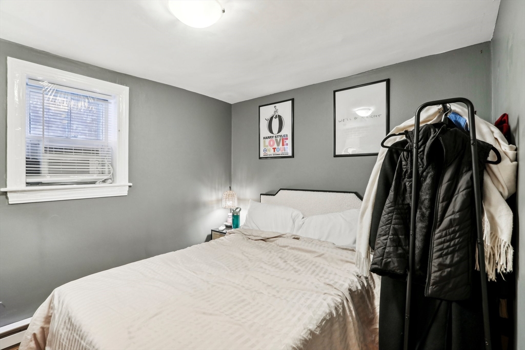 431 Shawmut Avenue, Unit 2 Boston, MA 02118 - Photo 20 of 25 a bedroom with a bed and a painting on the wall
