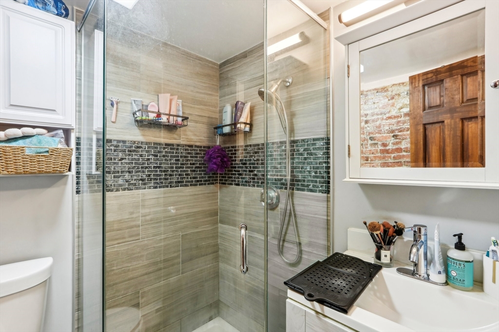 431 Shawmut Avenue, Unit 2 Boston, MA 02118 - Photo 22 of 25 a bathroom with a shower