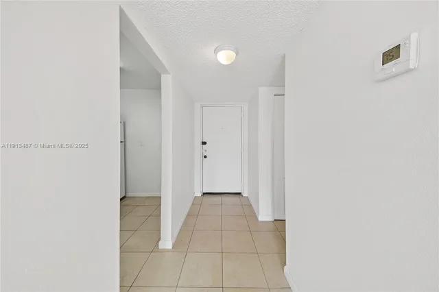 a view of a hallway with a white walls