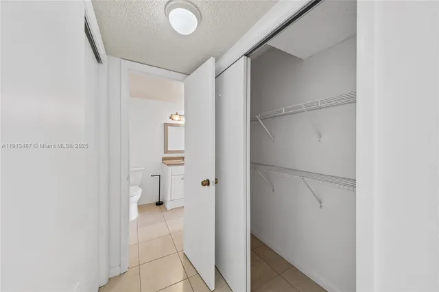 a bathroom with a shower and a sink