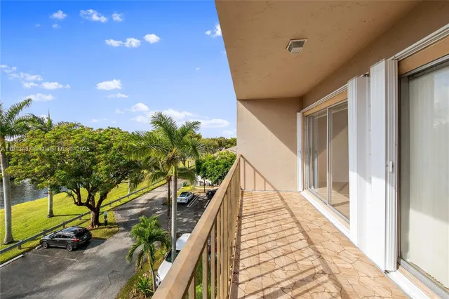 a view of balcony and wooden floor