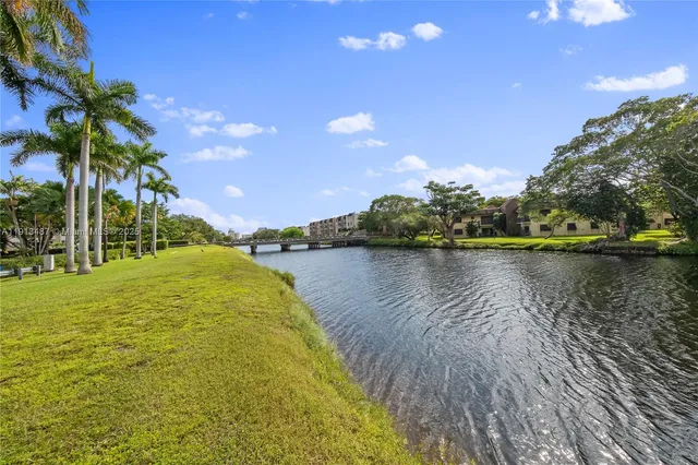 a view of a patio with a table and chairs