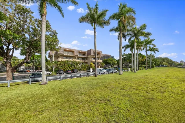 a view of a street with cars