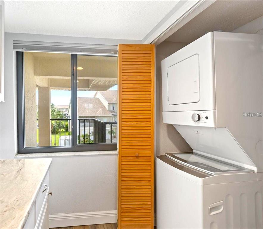 8210 Aquila Street, Unit 227 Port Richey, FL 34668 - Photo 18 of 68 a bathroom with a window sink and mirror
