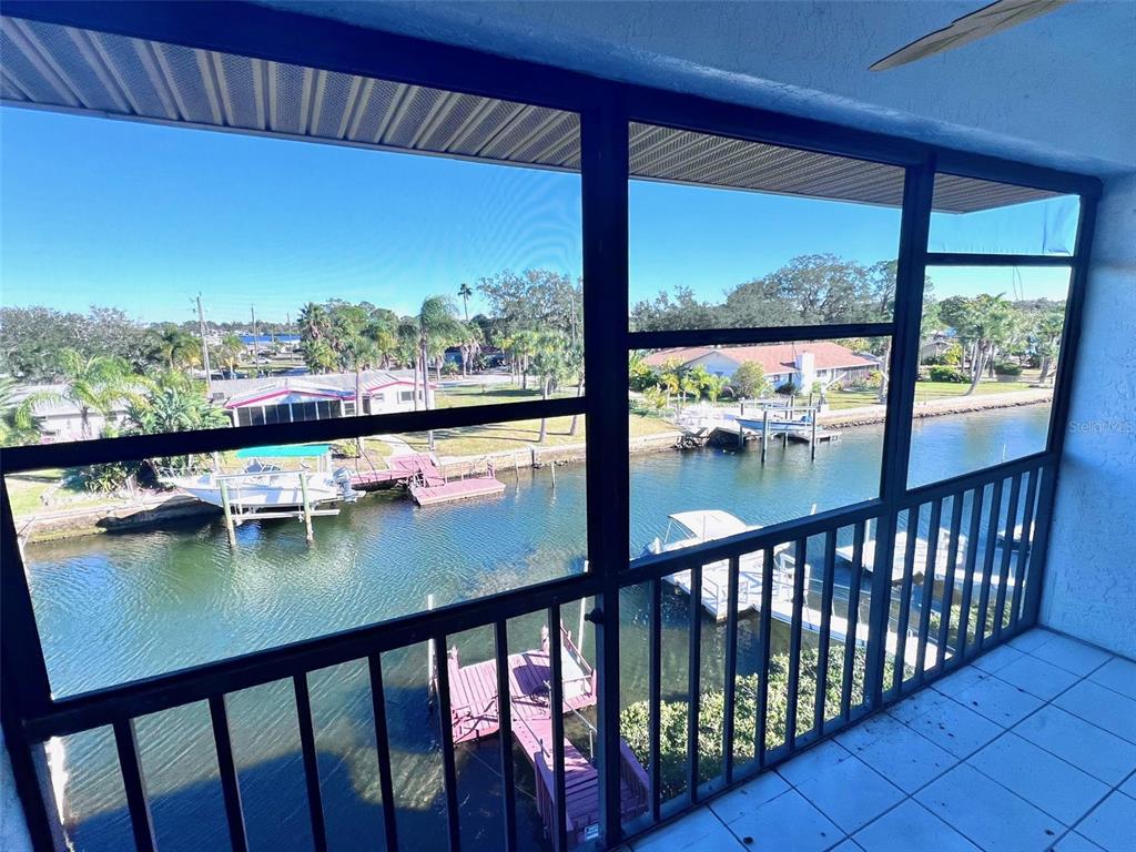 8210 Aquila Street, Unit 227 Port Richey, FL 34668 - Photo 26 of 68 a view of swimming pool from a balcony