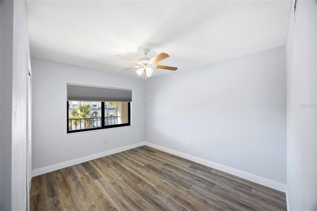 8210 Aquila Street, Unit 227 Port Richey, FL 34668 - Photo 39 of 68 an empty room with wooden floor and window