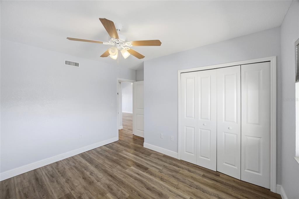 8210 Aquila Street, Unit 227 Port Richey, FL 34668 - Photo 40 of 68 a view of empty room with wooden floor