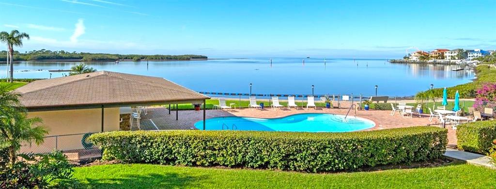 8210 Aquila Street, Unit 227 Port Richey, FL 34668 - Photo 59 of 68 a view of a swimming pool with an outdoor space and seating area