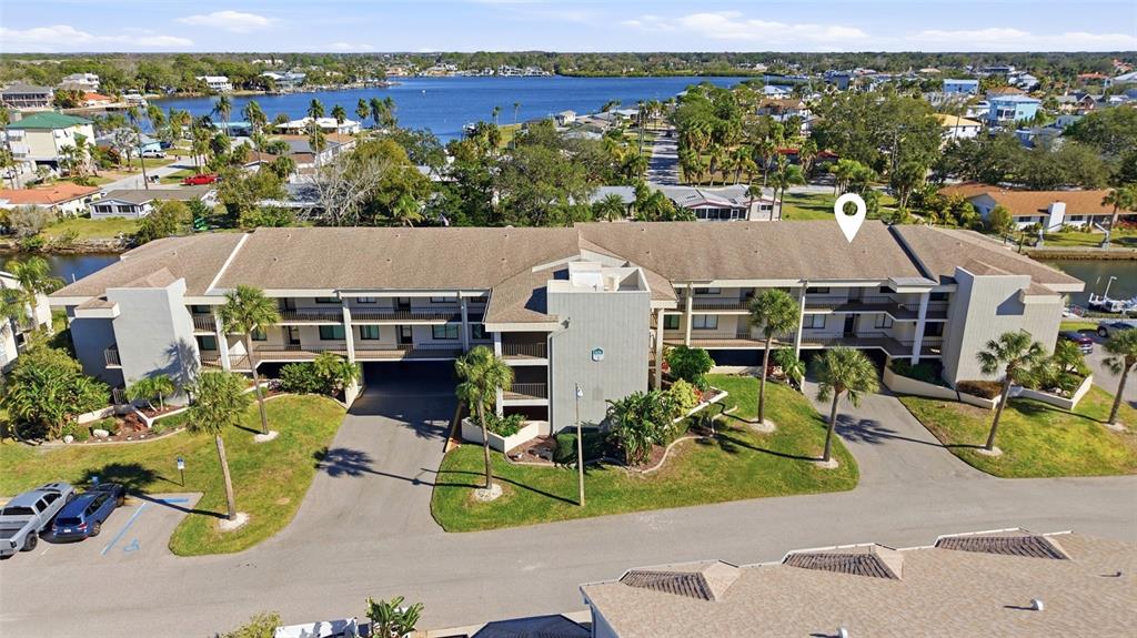8210 Aquila Street, Unit 227 Port Richey, FL 34668 - Photo 6 of 68 an aerial view of a house with a swimming pool and outdoor seating