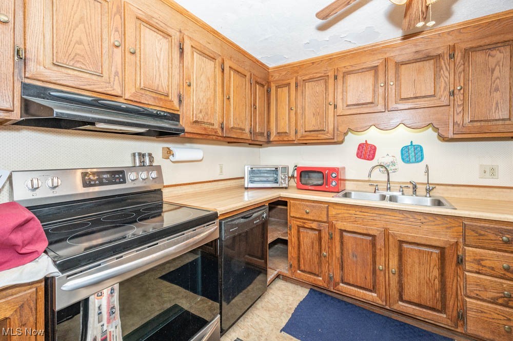 103 Valley Road Damascus, OH 44619 - Photo 2 of 27 Kitchen with sink, stainless steel electric range, black dishwasher, ceiling fan, and light tile patterned flooring