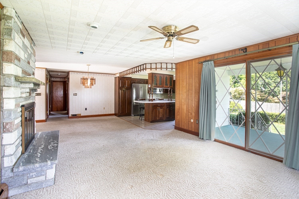 74 Kenyon Road Tiverton, RI 02878 - Photo 8 of 30 a view of a livingroom with a ceiling fan and window