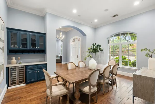 a view of a dining room with furniture window and wooden floor