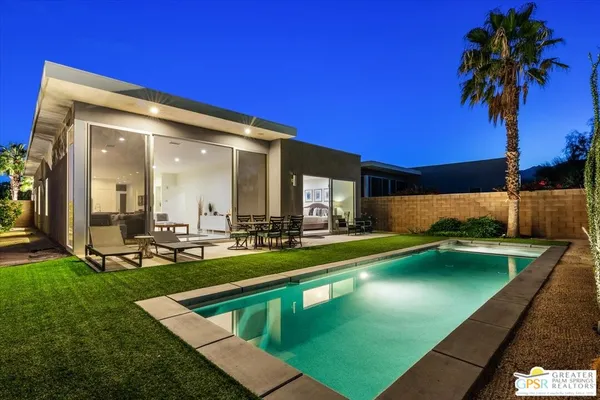 a view of a house with swimming pool