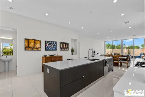 a kitchen with stainless steel appliances granite countertop a sink and cabinets