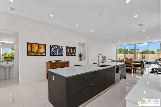 a kitchen with stainless steel appliances granite countertop a sink and cabinets