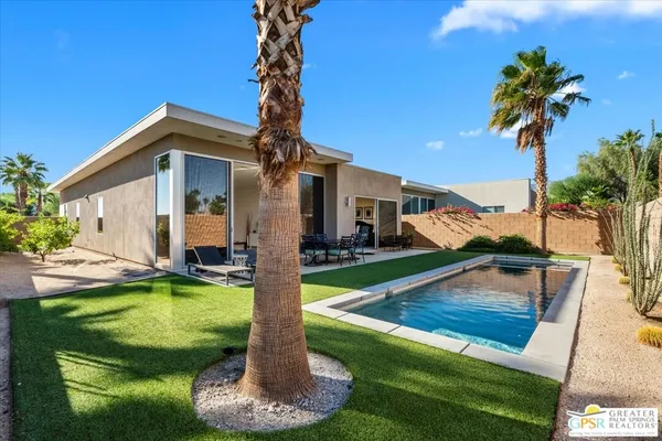a view of a house with swimming pool