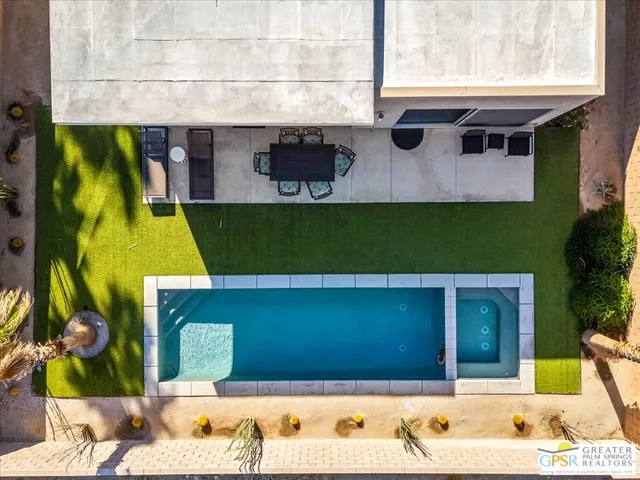 a view of swimming pool with a yard