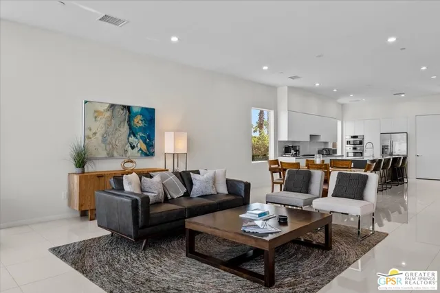 a living room with furniture and a rug