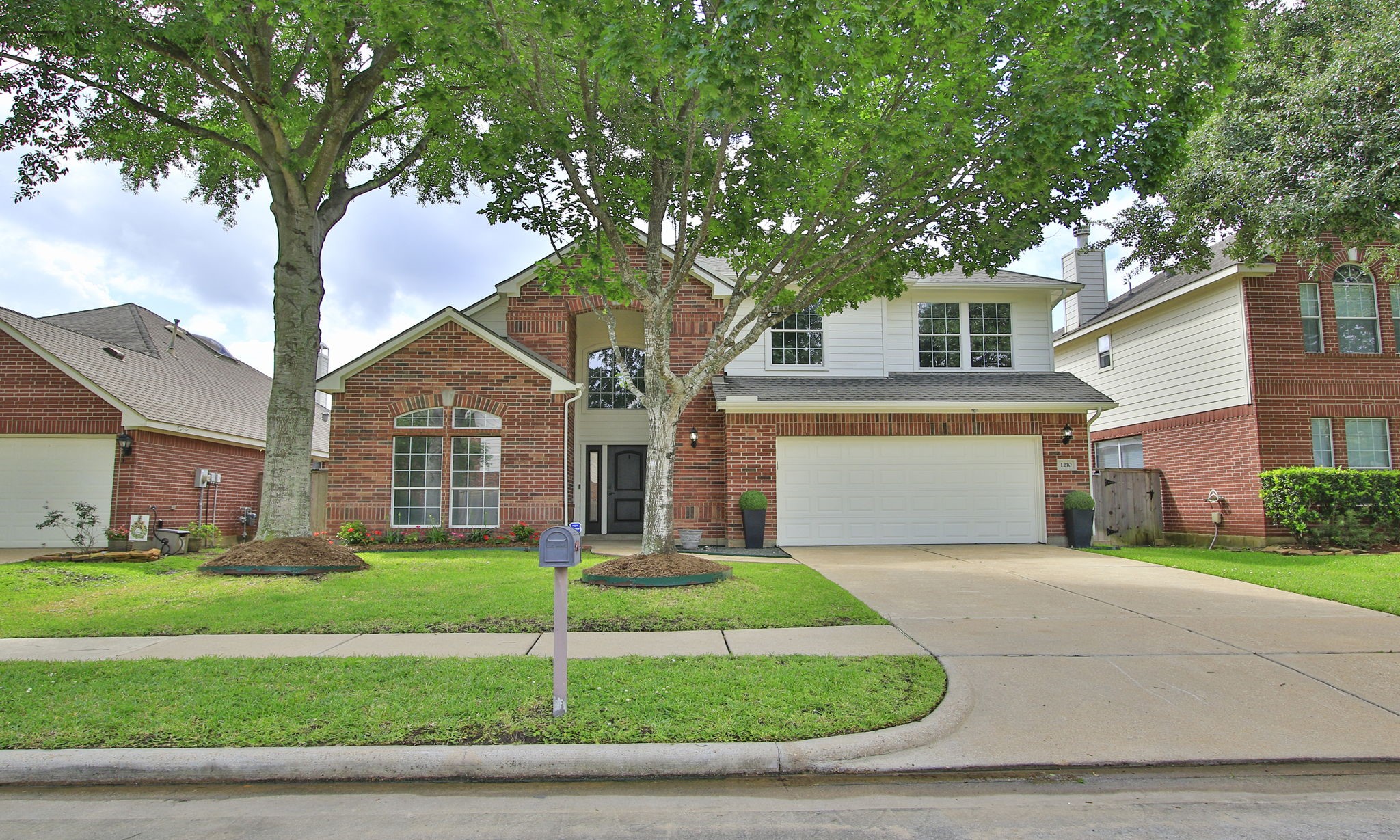 1210 Berwick Manor Court Spring, TX 77379 - Photo 5 of 50 a front view of a house with a yard and garage