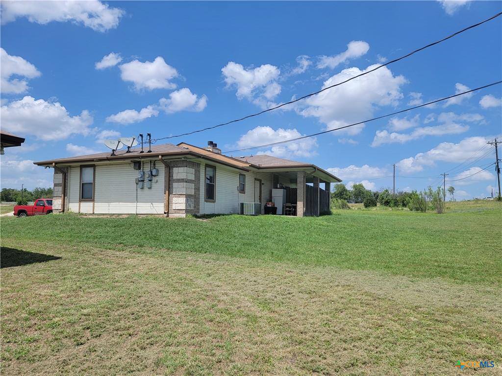 700 Trimmier Road Killeen, TX 76541 - Photo 2 of 2 A well-maintained structure with a covered patio offers an inviting outdoor living space.