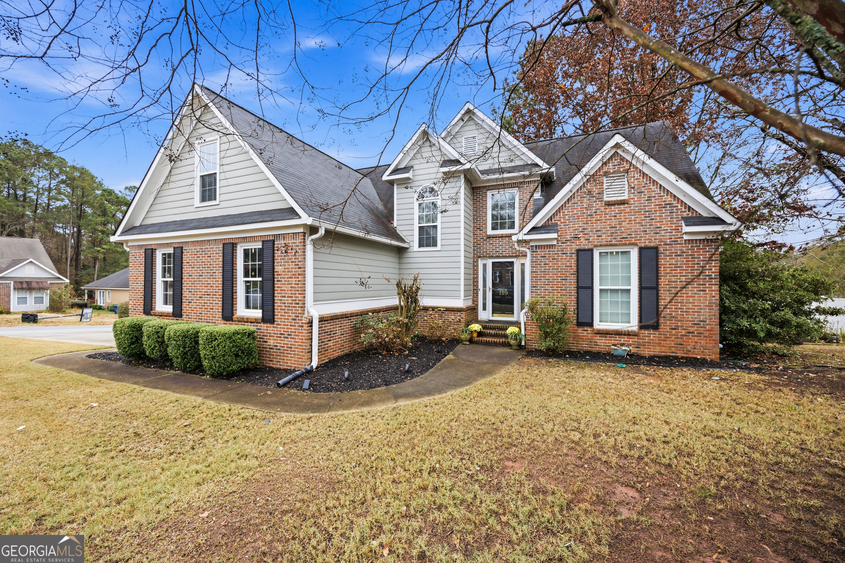 199 Springfield Boulevard Macon, GA 31210 - Photo 2 of 44 a front view of a house with a yard