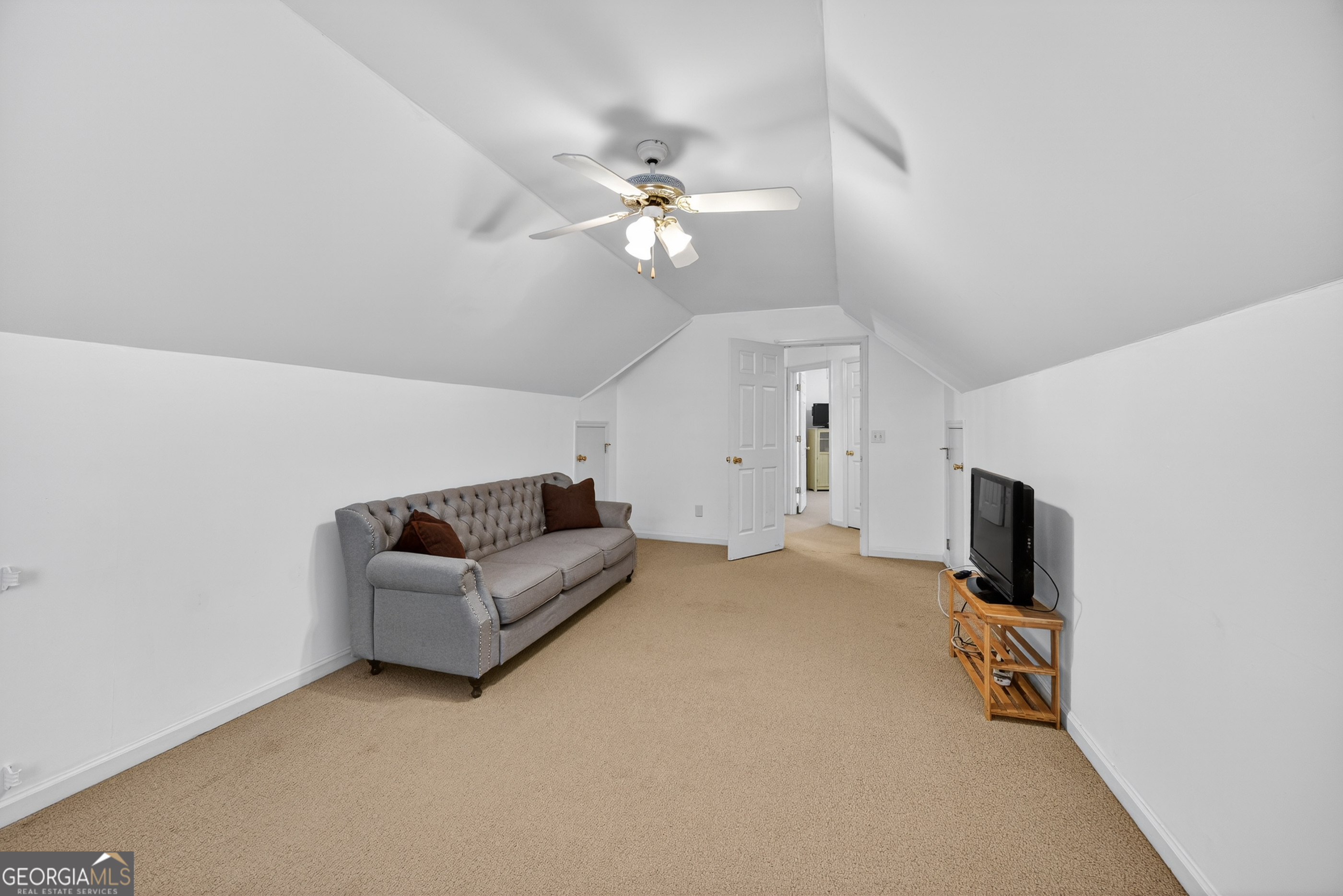 199 Springfield Boulevard Macon, GA 31210 - Photo 32 of 44 a living room with furniture and a flat screen tv