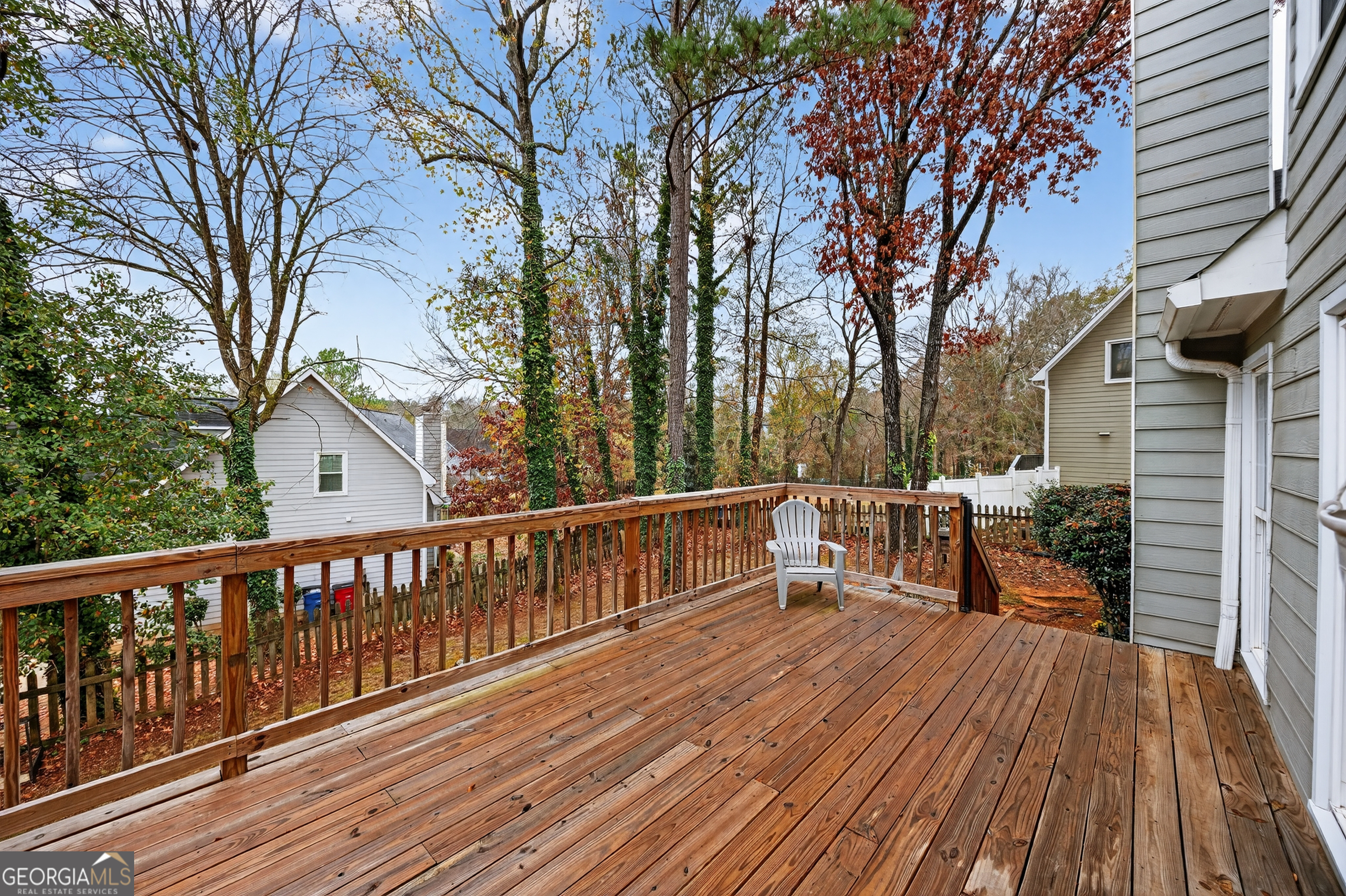 199 Springfield Boulevard Macon, GA 31210 - Photo 38 of 44 a view of a deck with chairs and large trees