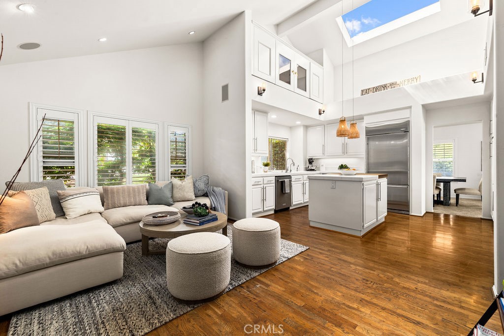 1 Centaurus, Unit 12 Irvine, CA 92603 - Photo 19 of 37 a living room with furniture and view of kitchen
