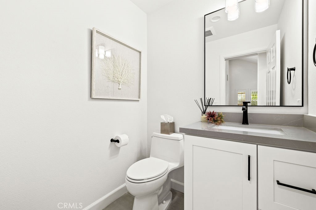 1 Centaurus, Unit 12 Irvine, CA 92603 - Photo 20 of 37 a bathroom with a toilet a sink and mirror