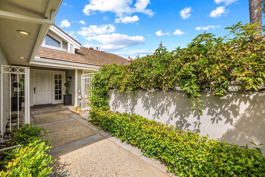 1 Centaurus, Unit 12 Irvine, CA 92603 - Photo 2 of 37 a front view of a house with a garden