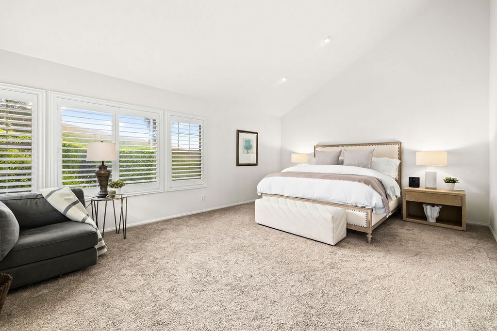 1 Centaurus, Unit 12 Irvine, CA 92603 - Photo 22 of 37 a spacious bedroom with a bed and glass window