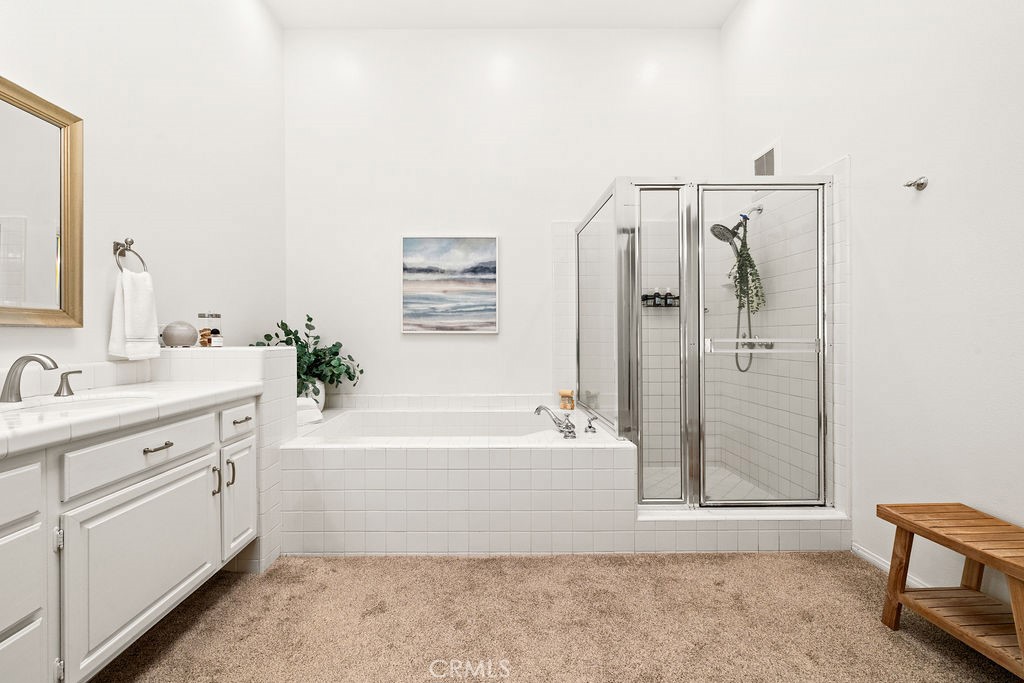 1 Centaurus, Unit 12 Irvine, CA 92603 - Photo 25 of 37 a bathroom with a bathtub sink and mirror